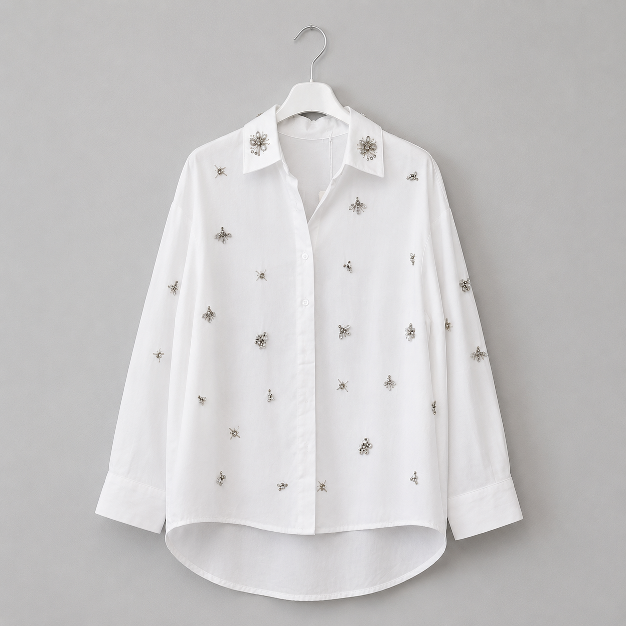 Bluse mit Schmuckapplikationen | Gr. 40-44