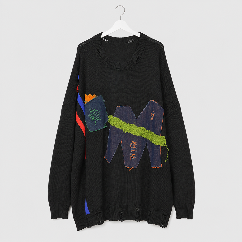 Schwarzer Oversize-Pullover mit Jeans-Patchwork und Glitzer-Details