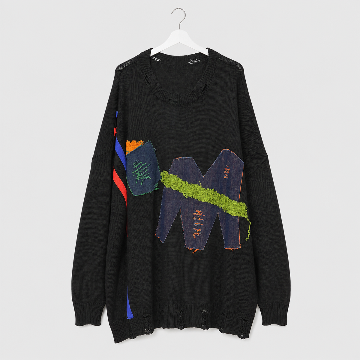 Schwarzer Oversize-Pullover mit Jeans-Patchwork und Glitzer-Details
